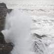 Waves breaking, Dyrholaey peninsula, Iceland. For scale, note the two men in blue jackets at the upper left.