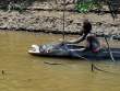 WomanCookingFish_OM69190