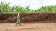 WomanWalkingRoadCut_OM64855