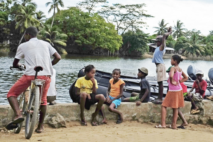 Children eyeing visitors.
