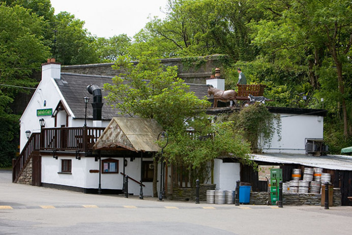 John Meade's Pub. "Flyover" refers to the road on the stone bridge seen above the pub roof.