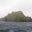 Skellig Michael in fog and rain. Location of Anchorite monastery with beehive huts, 6th century