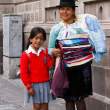 Woman selling wool scarves from Otovalo. Quito.